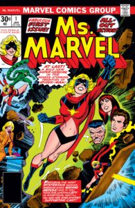 The cover of Ms Marvel Number 1. Carol Danvers burst through a wall whilst wearing a midriff baring outfit that gives away the level of male gaze happening here. A box out says "This female fights back". 